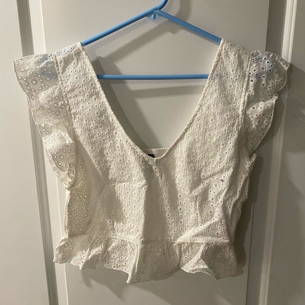 White sleeveless top